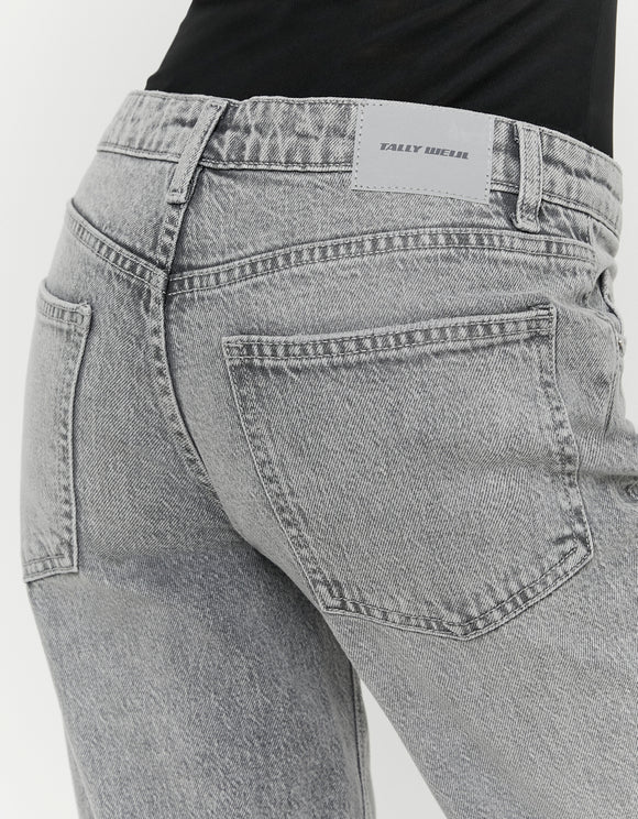 Detail of Tally Weijl grey low waist straight leg jeans back pocket and logo patch