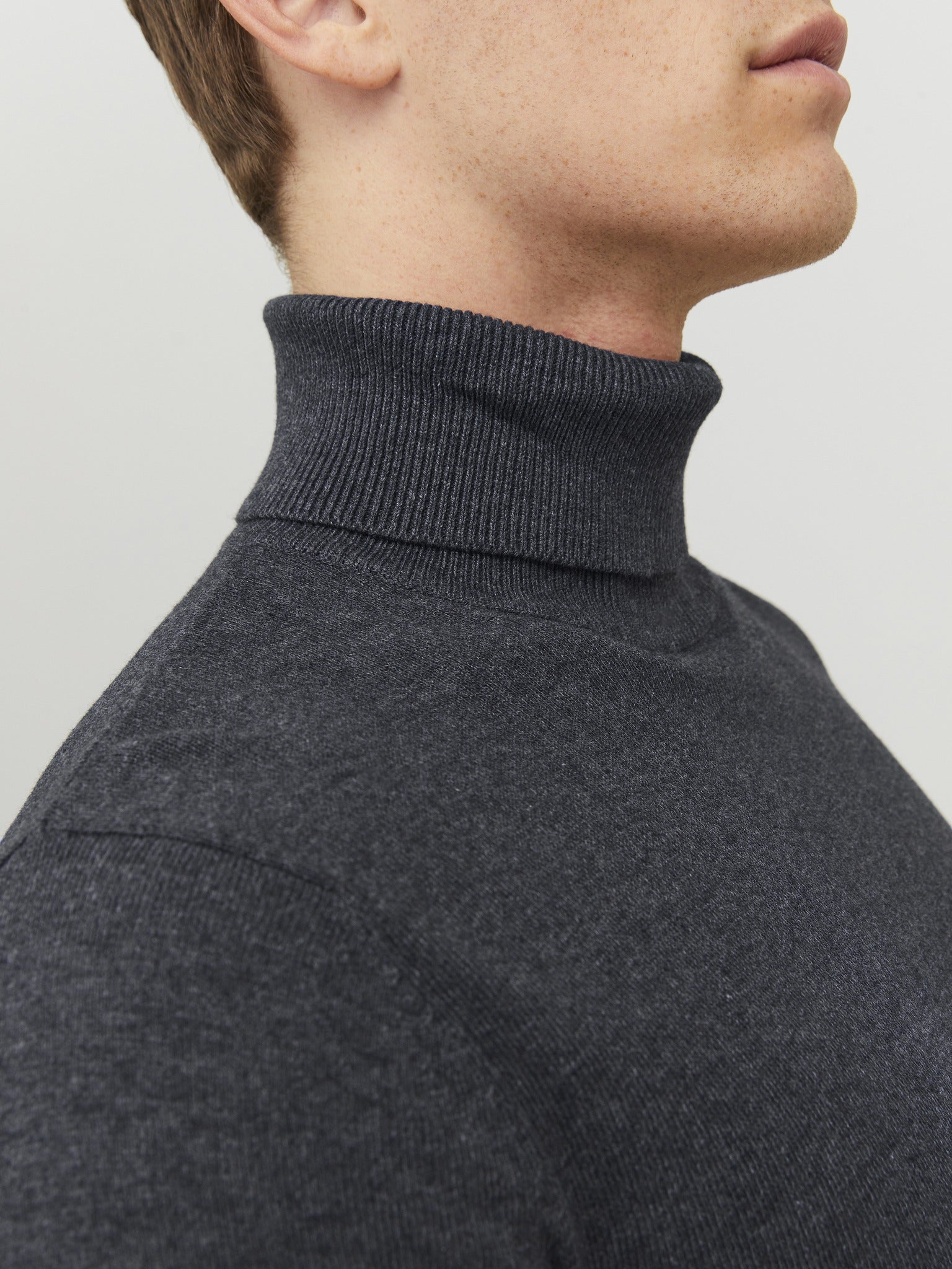 JACK & JONES Emil Knit Roll Neck Jumper in Dark Grey seated model view