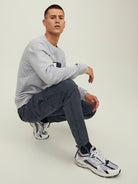 JACK & JONES JPSTACE Tucker Cargo Trousers in Asphalt seated model view
