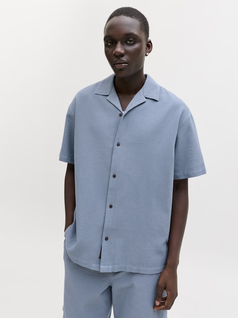 Angled model view of Blue Mirage resort shirt