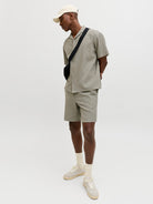 Angled model view of Vetiver waffle shorts