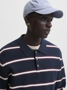 JACK & JONES Atocha Knit Stripe Polo in Sky Captain Sea Salt / Chocolate Truffle angled view on model