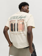 JACK & JONES Salamanco Photo Back Crew Neck Tee in Antique White seated model view