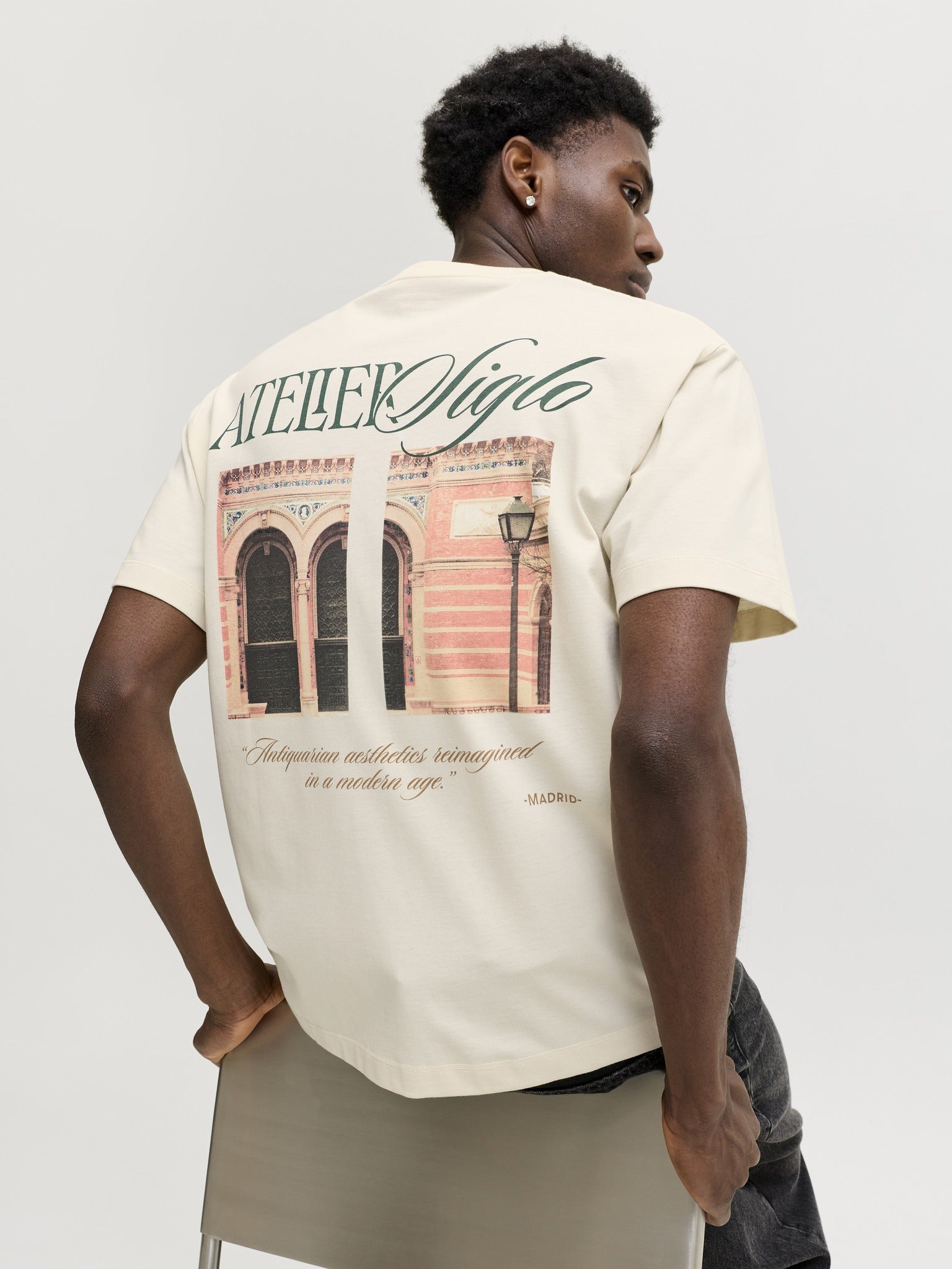 JACK & JONES Salamanco Photo Back Crew Neck Tee in Antique White seated model view