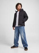 Jack Jones Junior Galaxy Boys Puffer Jacket in Black angled view on model
