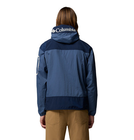 Person wearing a blue Columbia jacket on a white background