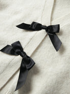 Black bow detail on NAME IT Rina Long Sleeve Knit Cardigan in Antique White