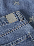 NAME IT Bella Barrel Glitter Jeans in Medium Blue Denim logo patch detail
