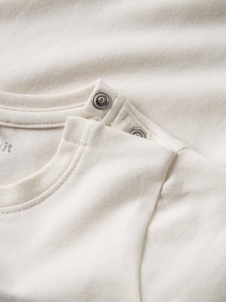 NAME IT Karse Top in Antique White snap button neckline detail