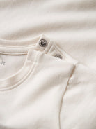 NAME IT Karse Top in Antique White snap button neckline detail