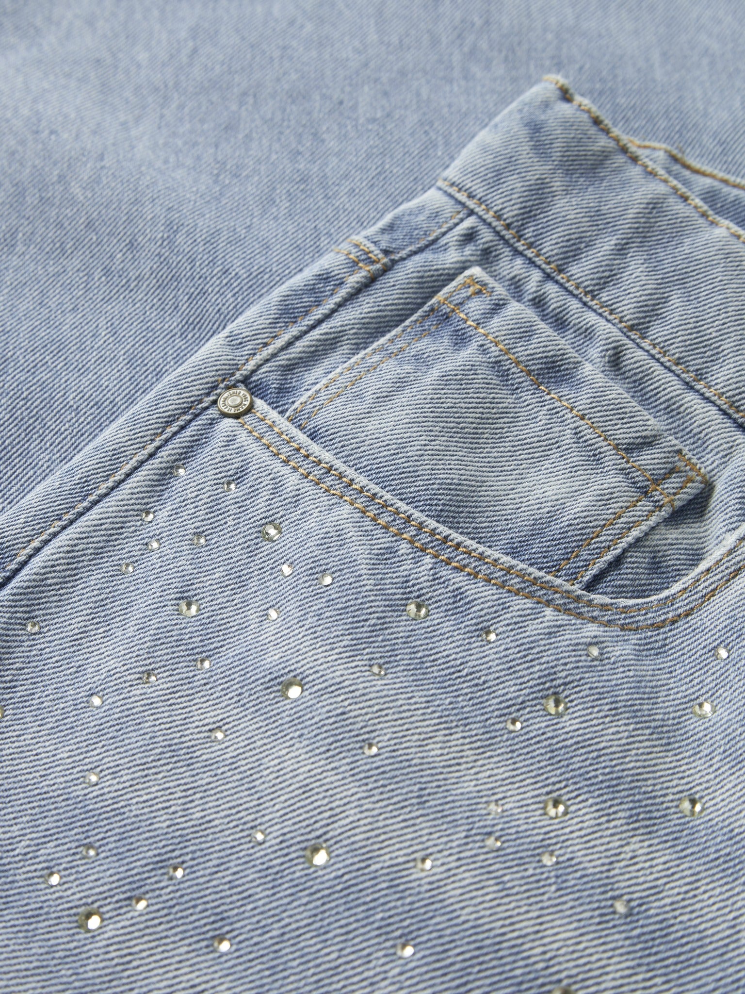 NAME IT Bella Wide Rhine Jeans in Light Blue Denim rhinestone detail angled view