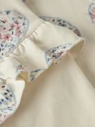 NAME IT Kiwile Long Sleeve Sweatshirt Top in Antique White ruffle trim and floral print