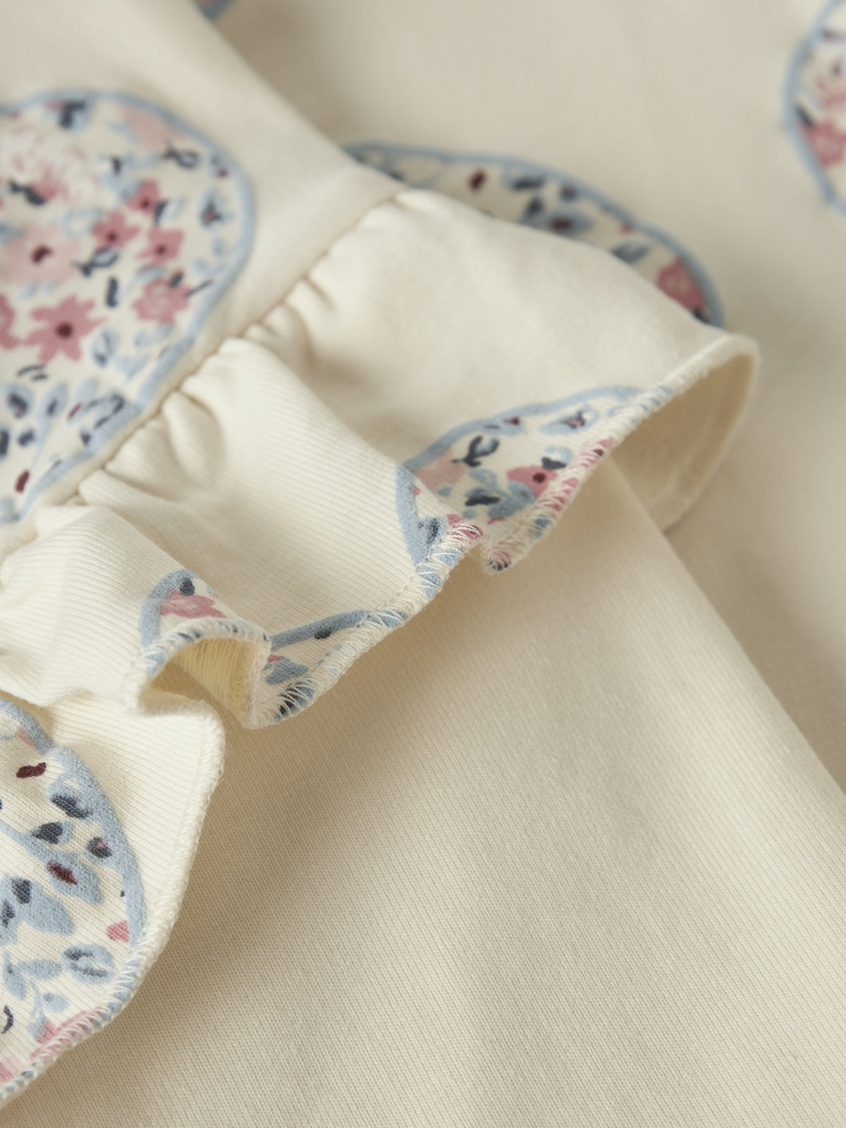 NAME IT Kiwile Long Sleeve Sweatshirt Top in Antique White ruffle trim and floral print