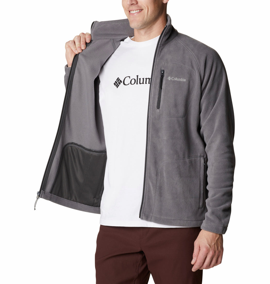 Person wearing a gray Columbia jacket over a white shirt on a white background