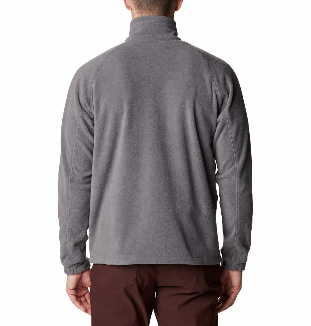 Person wearing a gray fleece jacket on a white background