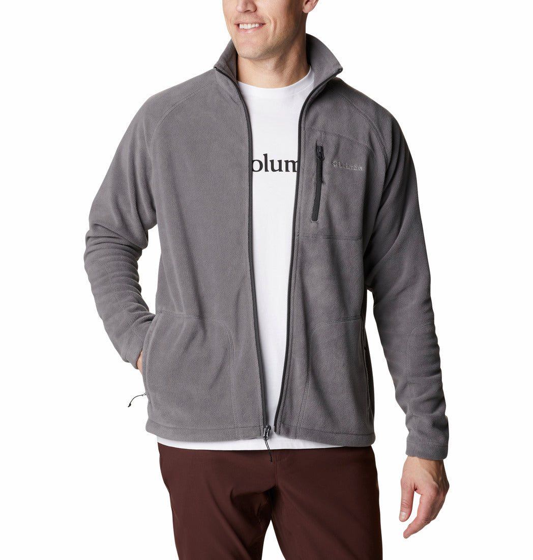 Man wearing a gray fleece jacket with a visible brand logo on a white background