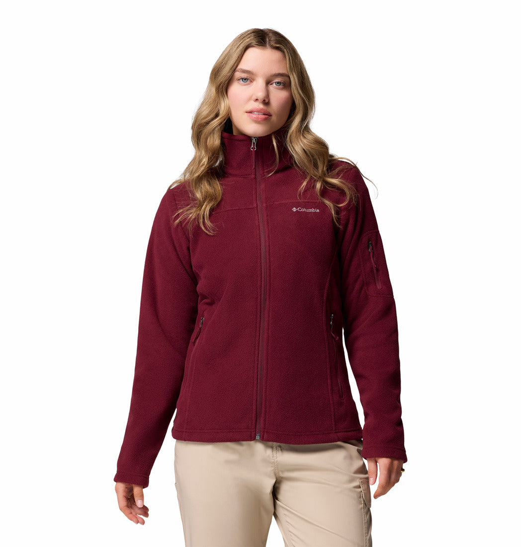Woman wearing a maroon Columbia fleece jacket on a white background