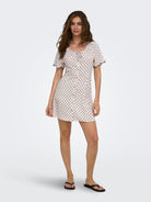ONLY Emmia Short Sleeve Embroidered Short Dress Print in Pumice Stone DELICIOSO DOT angled model view