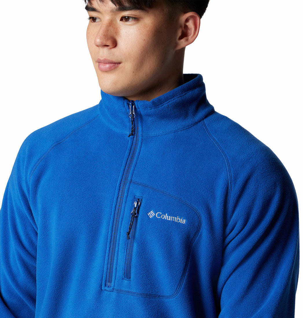 Person wearing a blue Columbia pullover on a white background