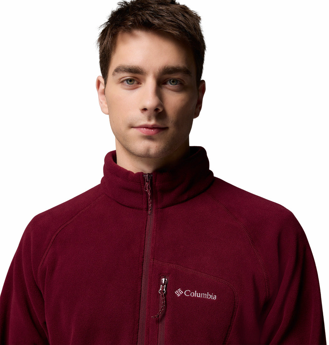 Man wearing a maroon Columbia fleece jacket on a white background