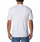 Person wearing a plain white t-shirt on a white background