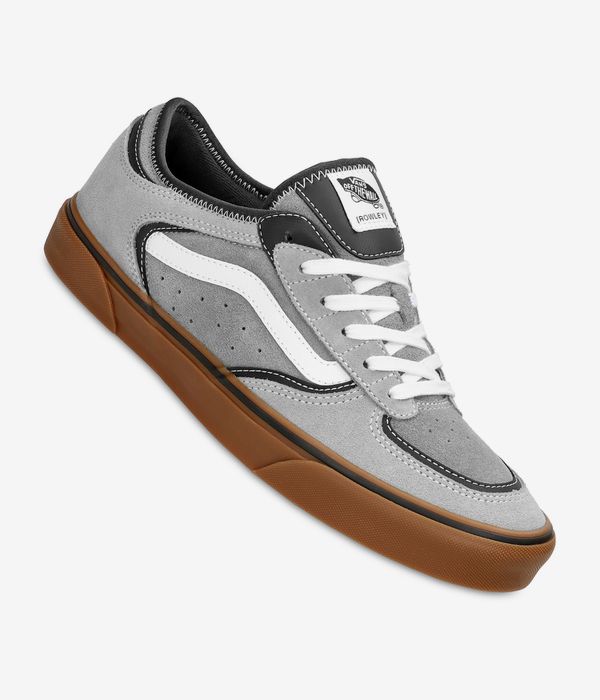 Gray sneaker with brown sole on a white background