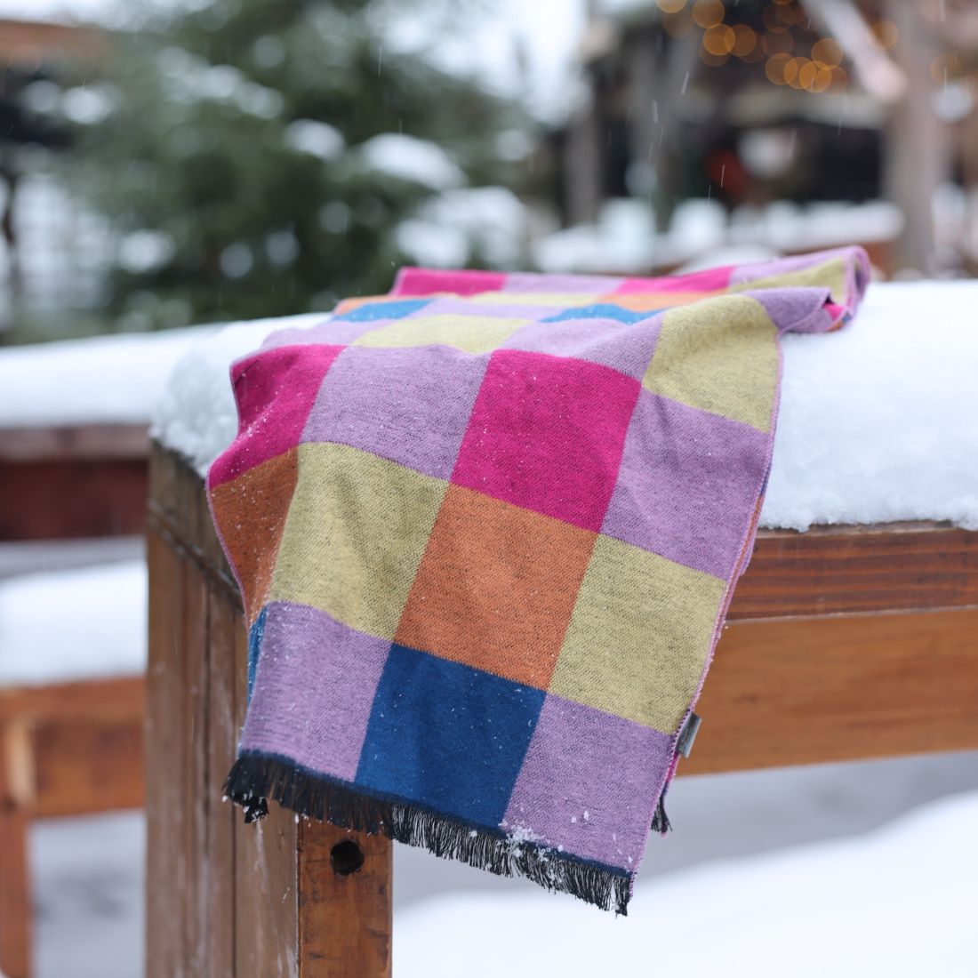 Multi Check Bamboo Scarf on a fence with snow