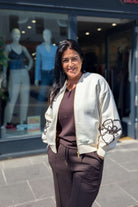 Tina showcasing the Relax & Renew Ruby Cream Bomber. It's gorgeous.