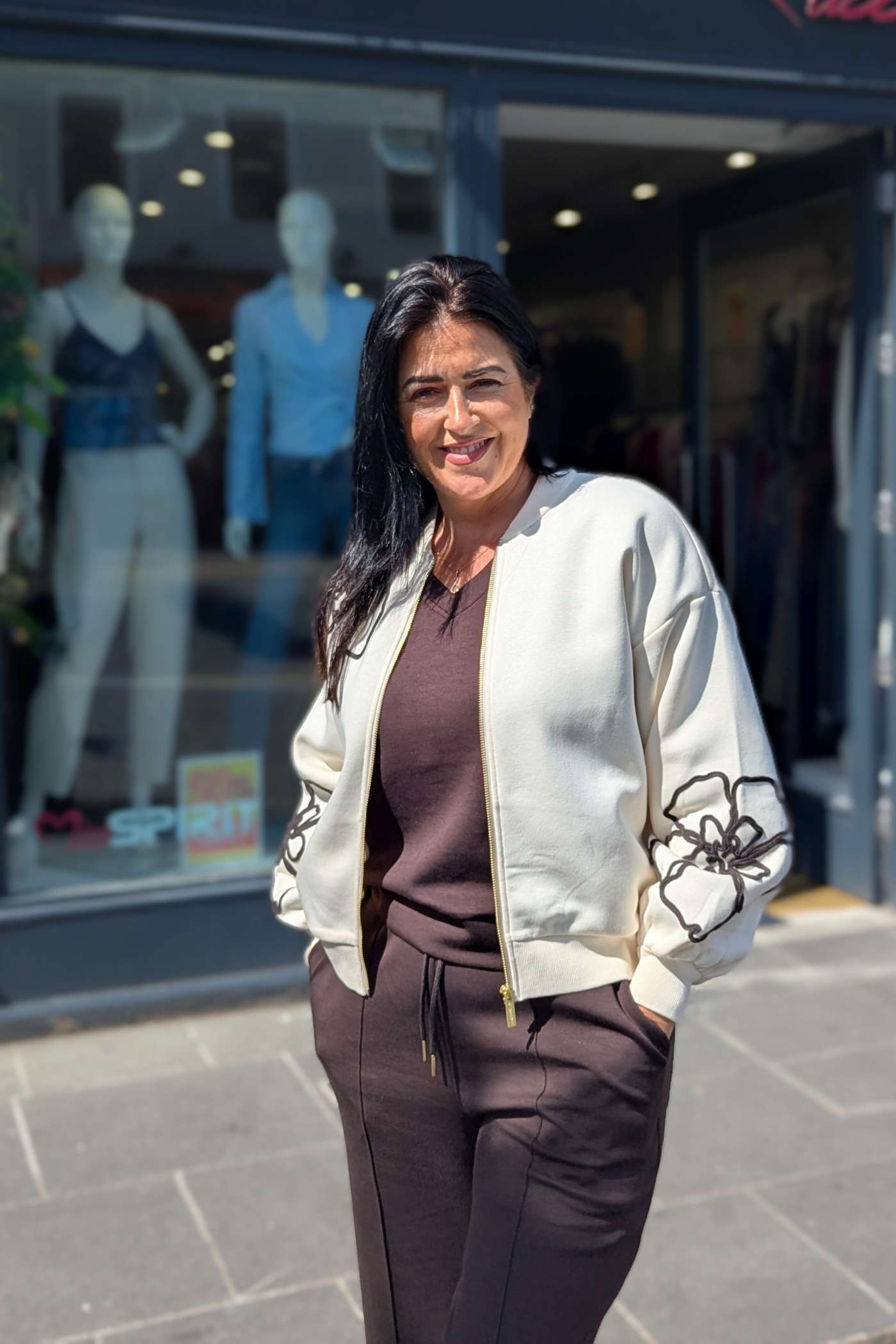 Tina showcasing the Relax & Renew Ruby Cream Bomber. It's gorgeous.