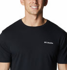 Man wearing a black Columbia t-shirt on a white background