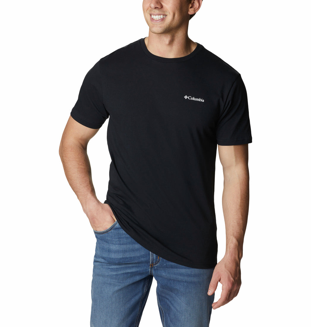 Man wearing a black t-shirt with a logo on a white background