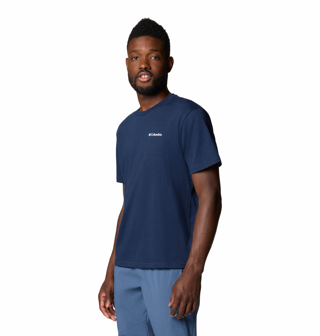 Man wearing a navy blue Columbia t-shirt on a white background