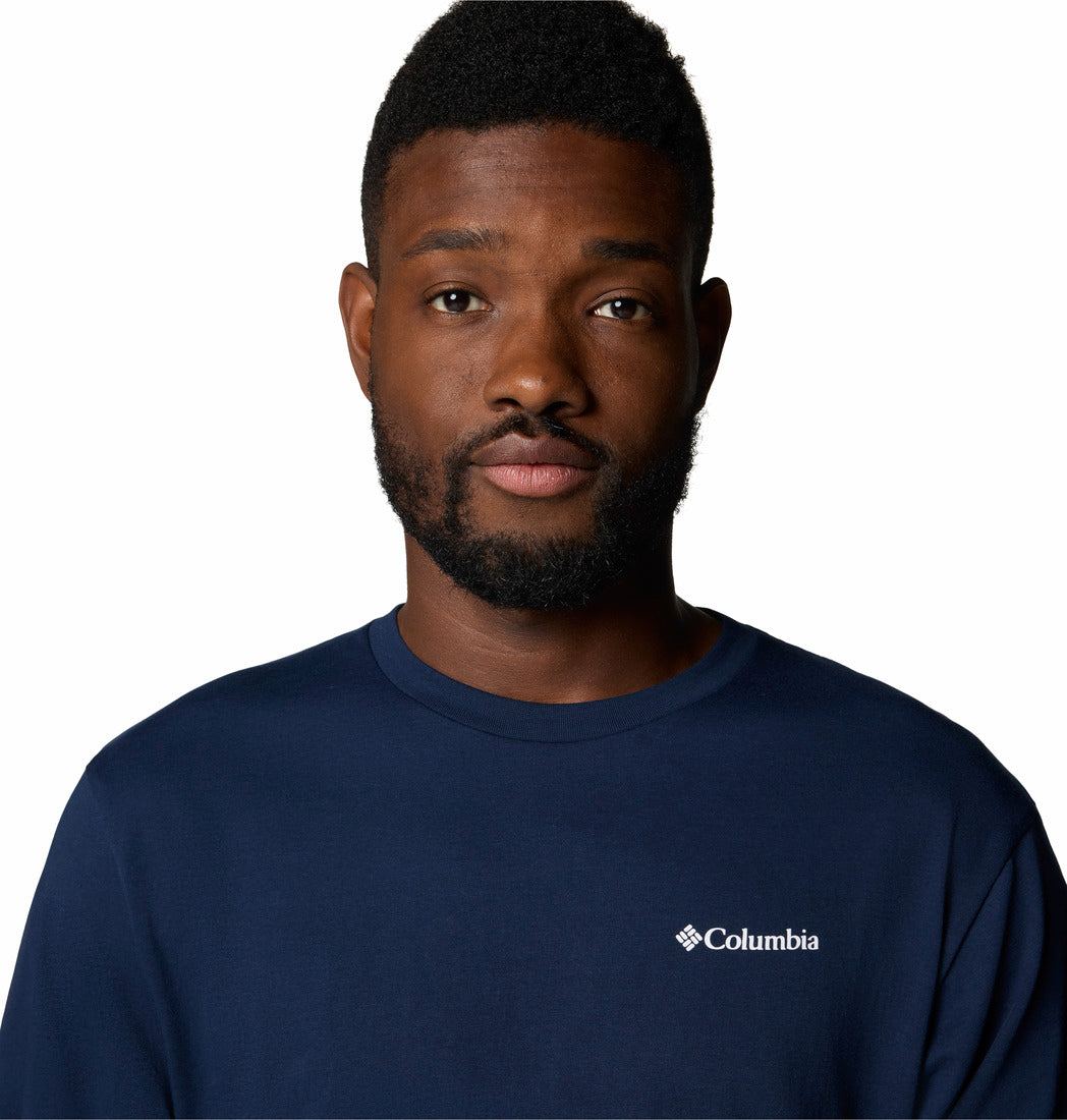 Man wearing a navy Columbia shirt against a white background
