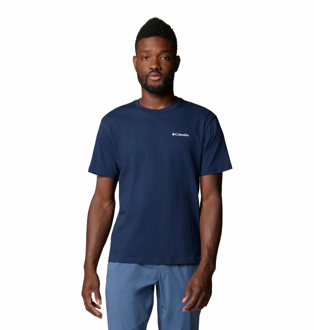 Man wearing a navy blue t-shirt with Columbia logo on a white background