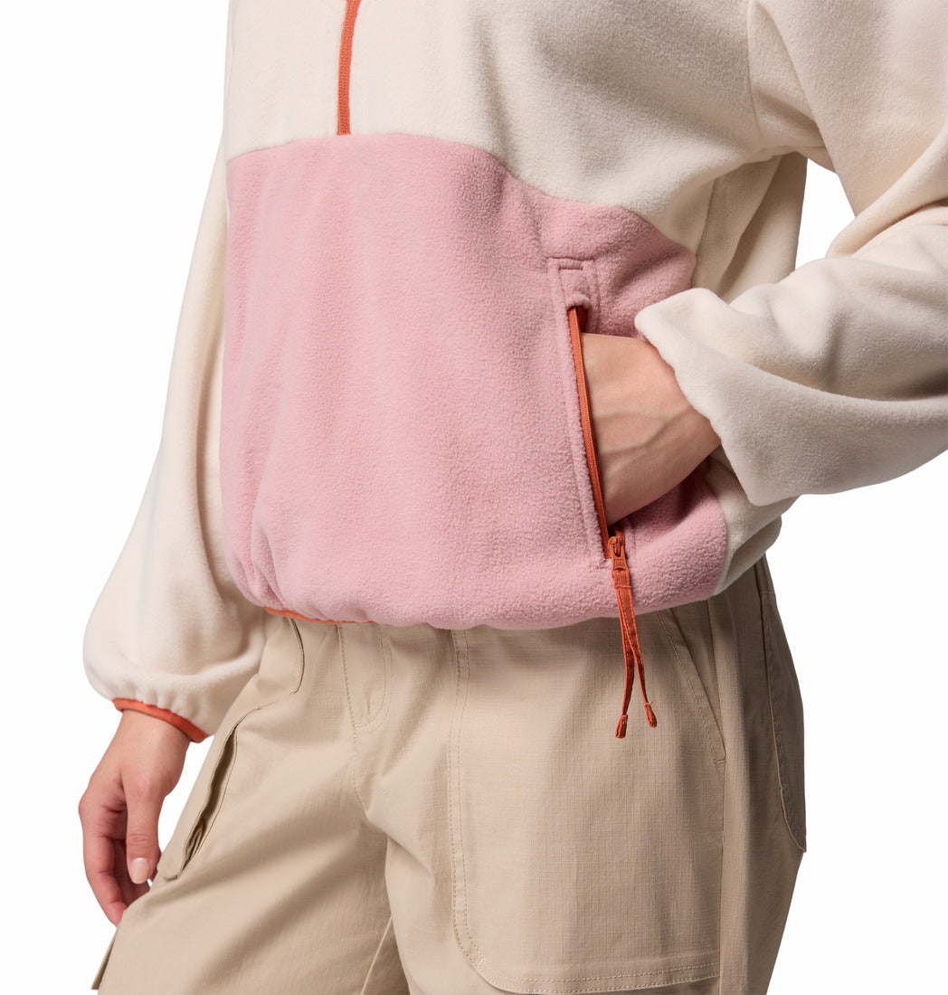 Person holding a pink bag with orange straps on a white background