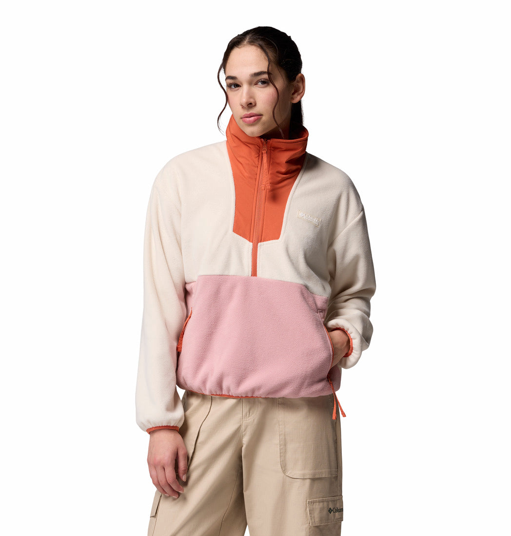 Person wearing a colorful pullover with a white background