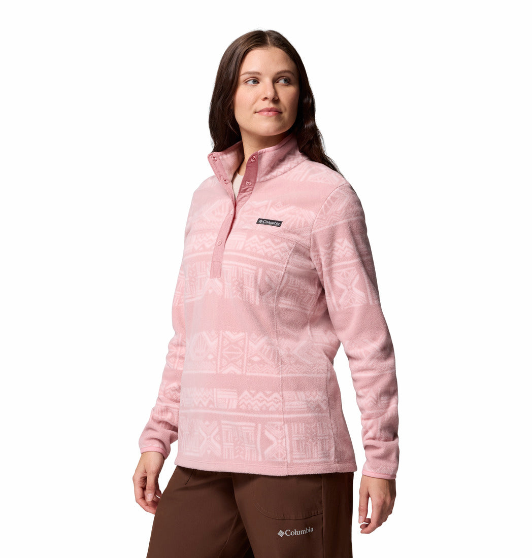 Woman wearing a pink patterned jacket on a white background