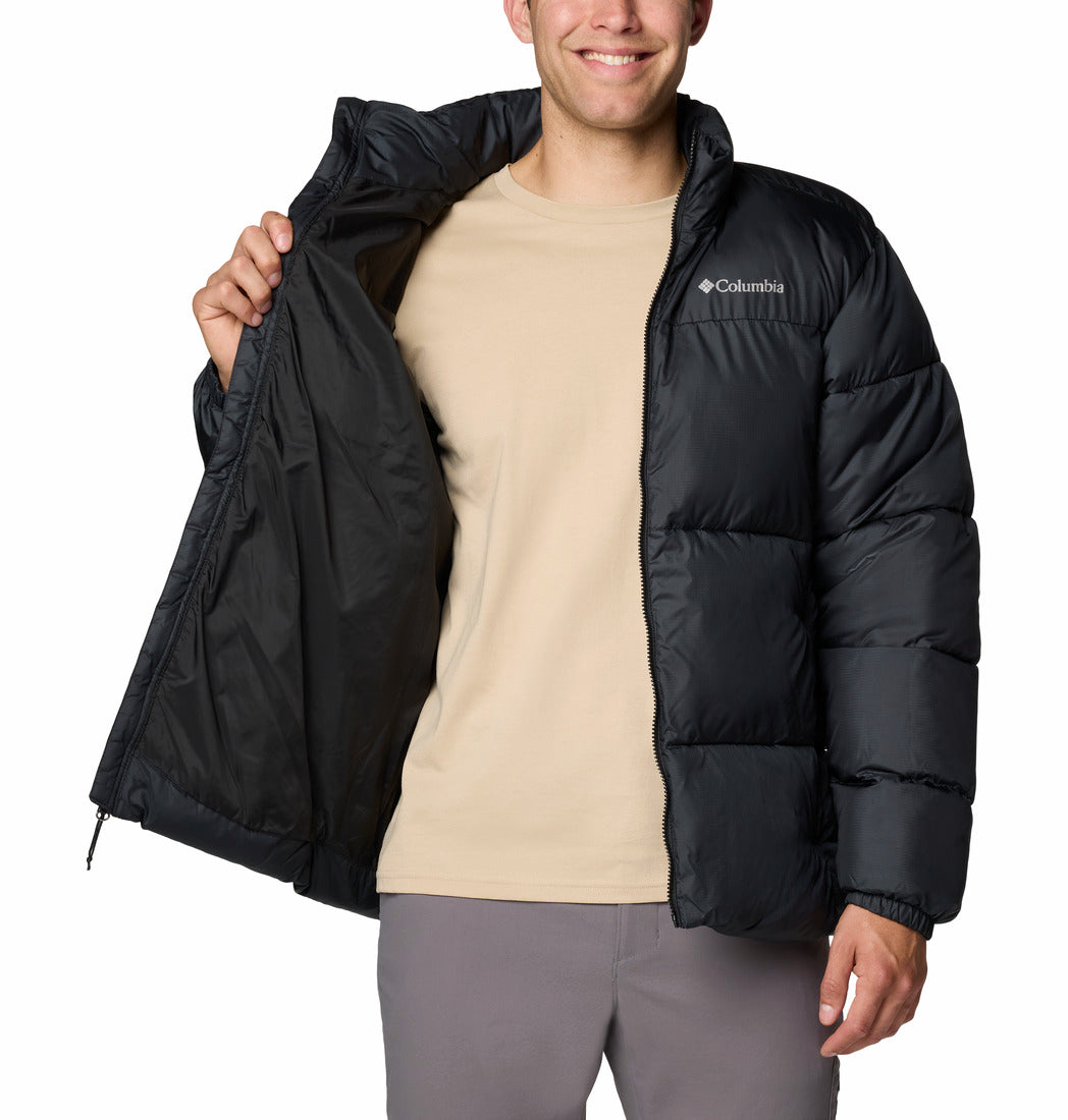 Person wearing a black Columbia jacket on a white background