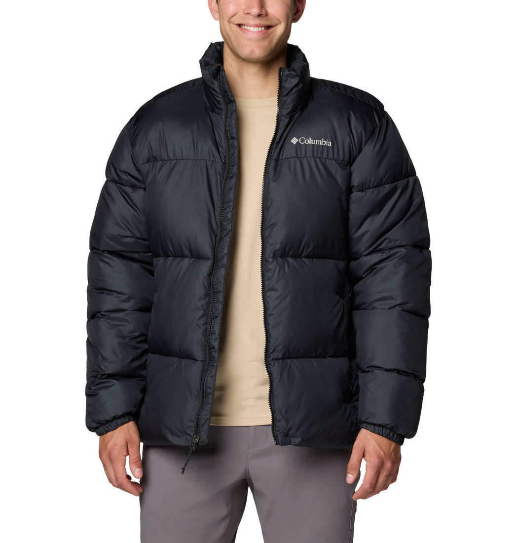 Person wearing a black Columbia jacket on a white background