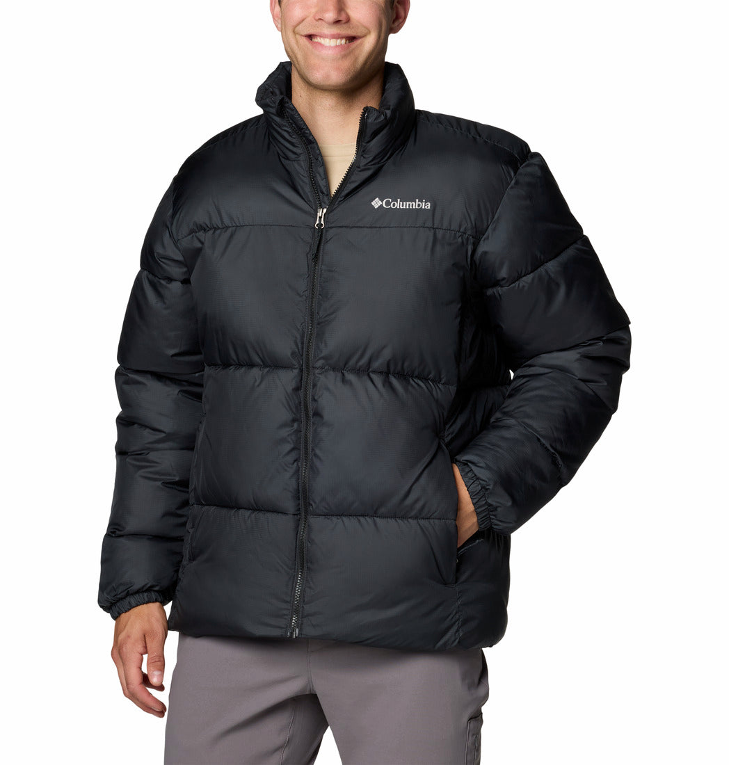 Person wearing a black Columbia jacket on a white background