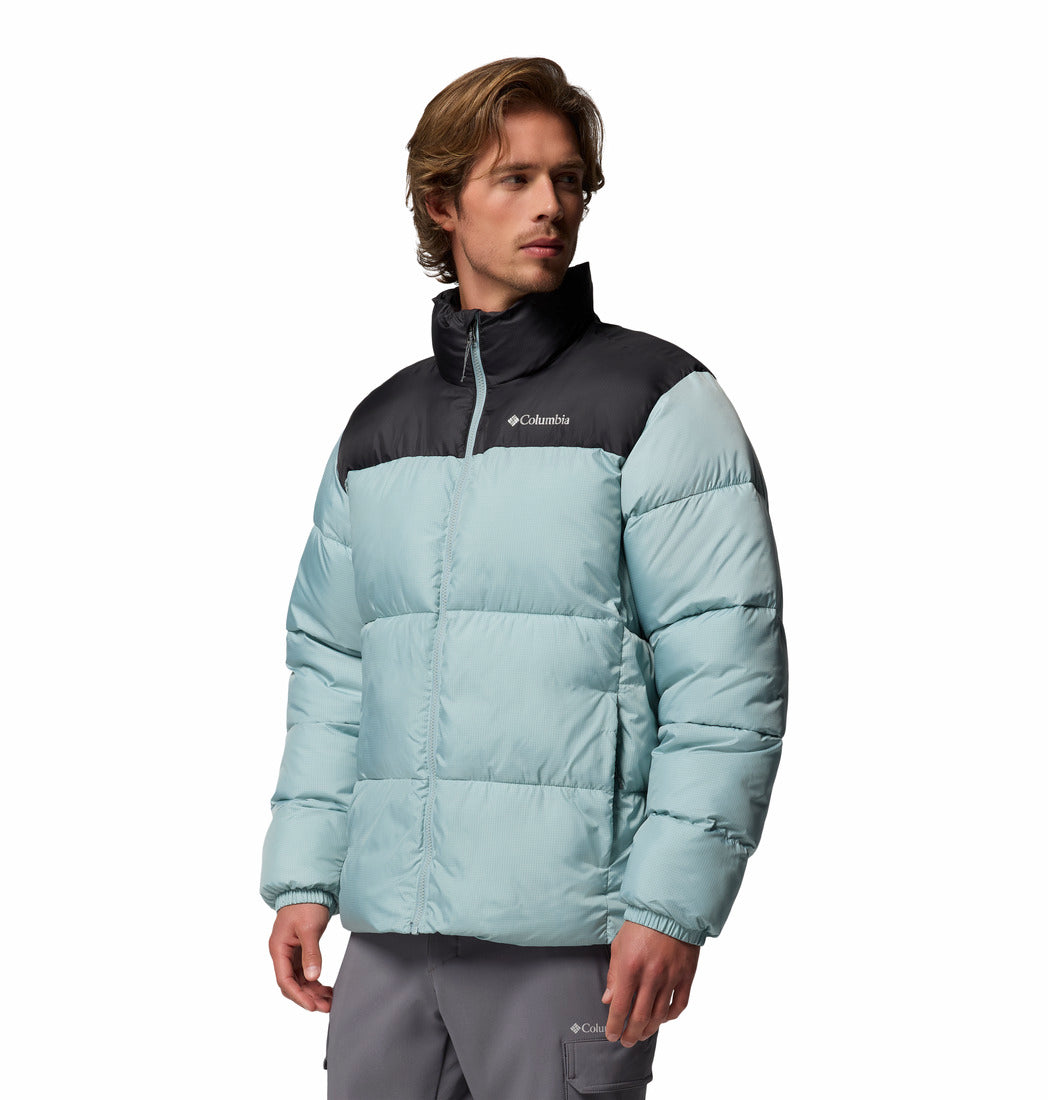 Person wearing a Columbia puffer jacket on a white background
