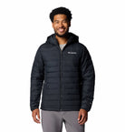 Man wearing a Columbia jacket on a white background