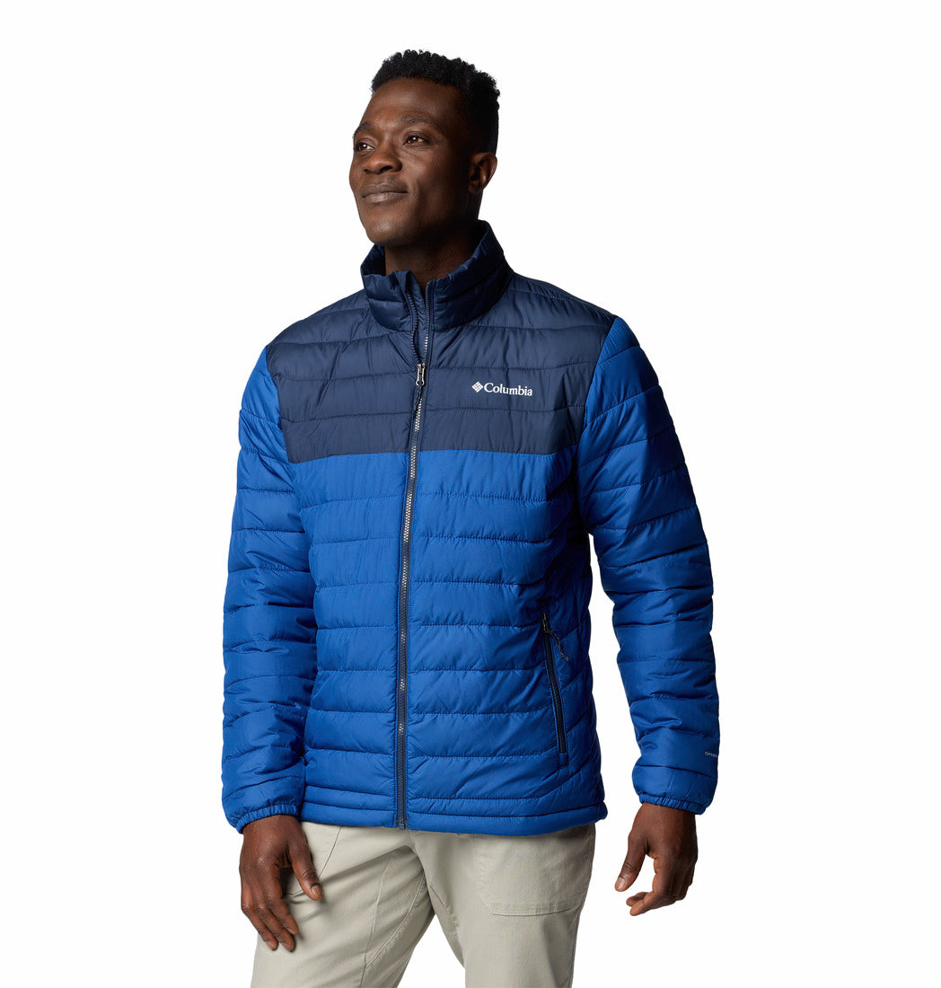 Man wearing a blue Columbia jacket on a white background