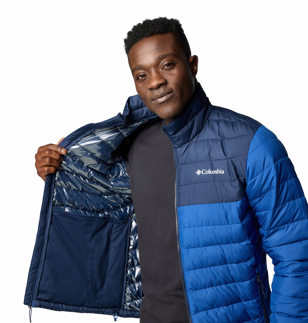 Man wearing a blue Columbia jacket on a white background