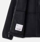 Black jacket with a visible brand label on a white background