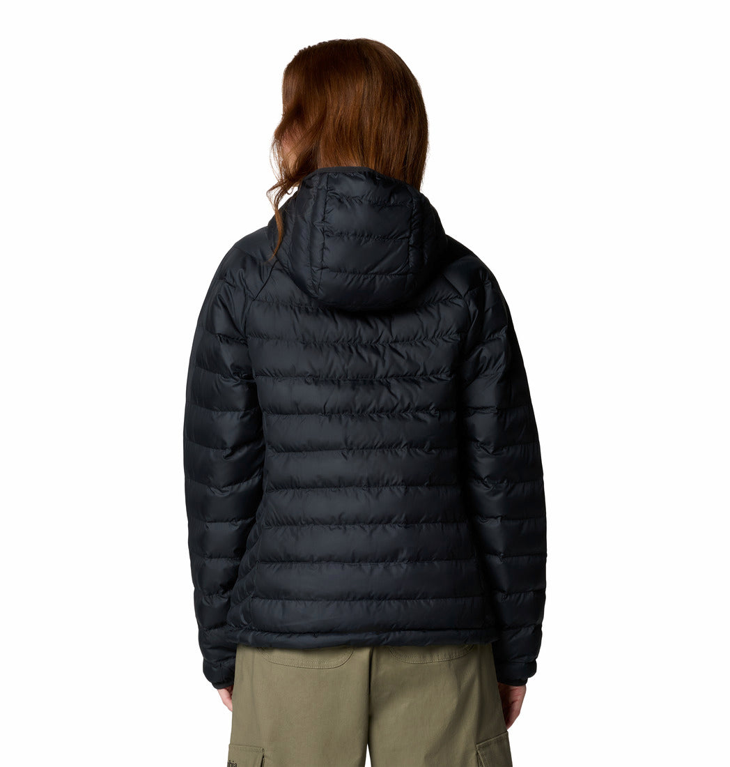 Person wearing a black puffer jacket on a white background
