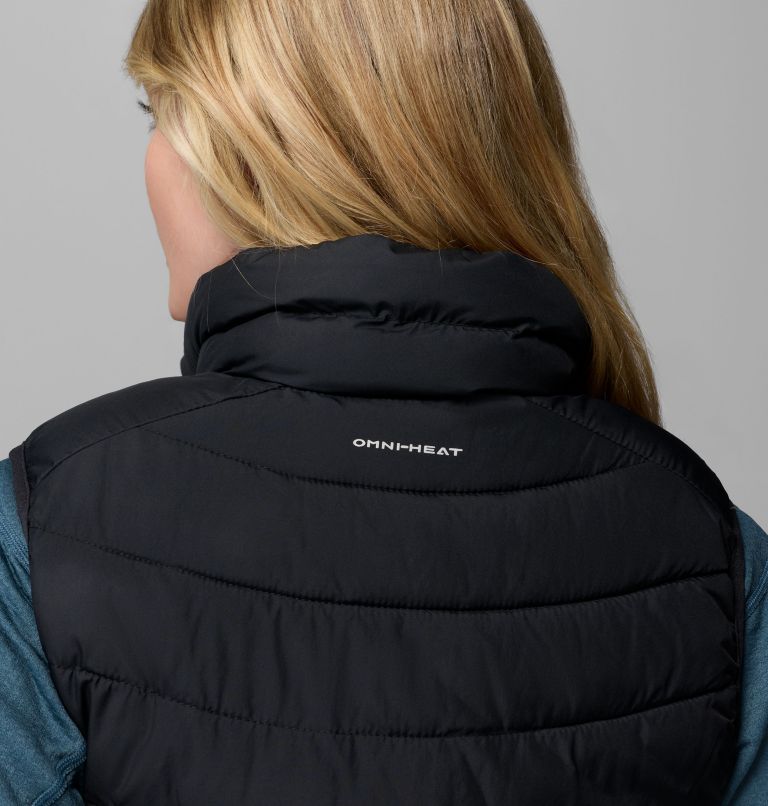 Black puffer vest with 'Omniheat' branding on a gray background