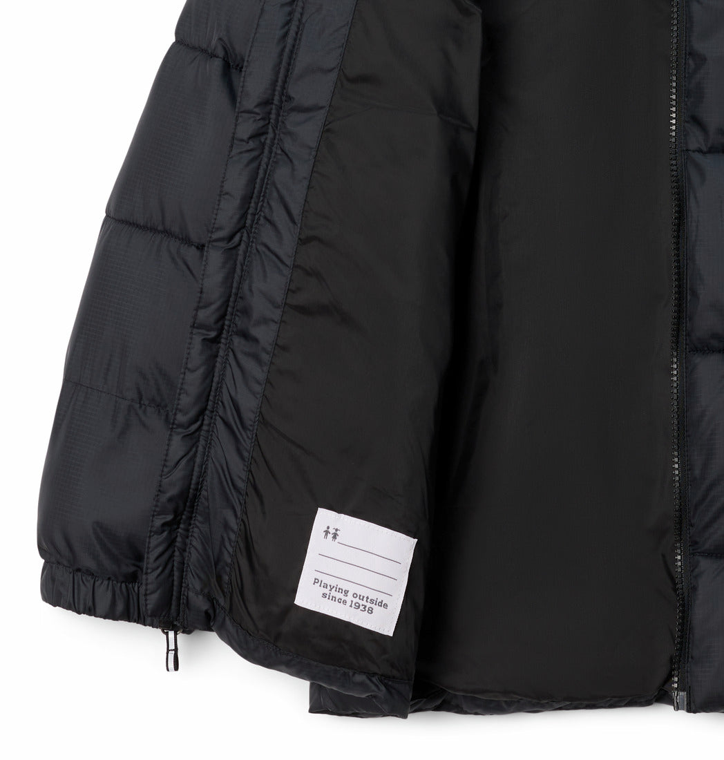 Black puffer jacket with a brand label on a white background