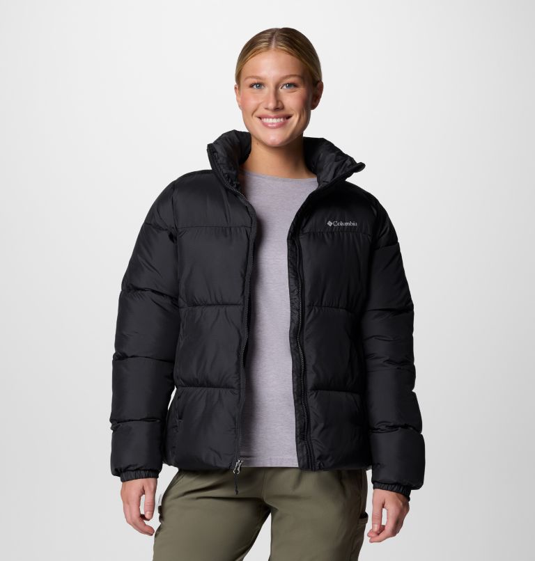 Person wearing a black puffer jacket with Columbia logo on a white background