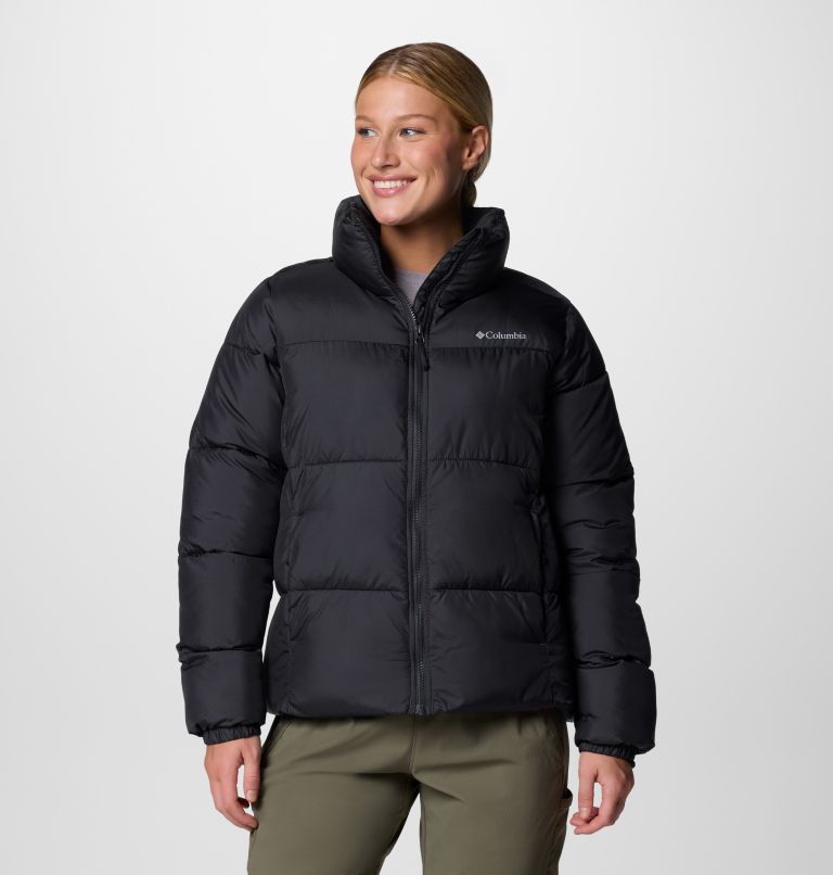 Person wearing a black puffer jacket with Columbia logo on a white background